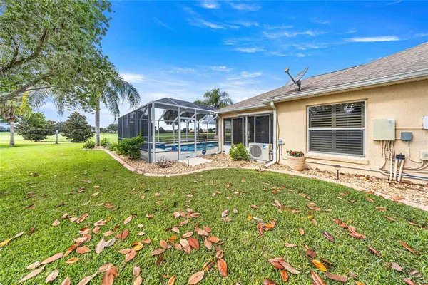 a view of grassy field with benches