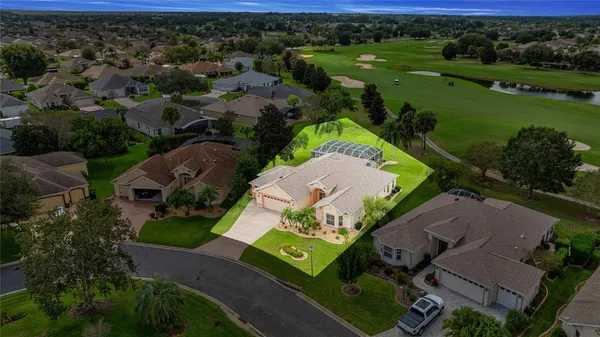 an aerial view of residential house with outdoor space and swimming pool