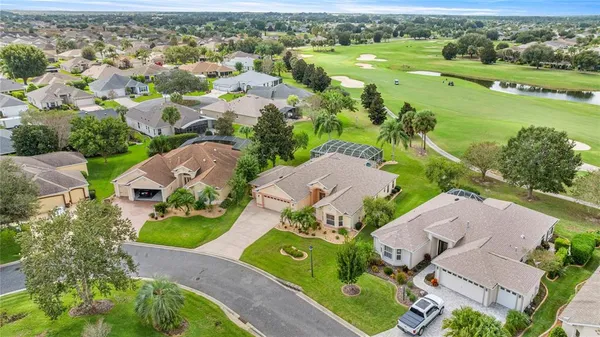 an aerial view of a houses with outdoor space and street view