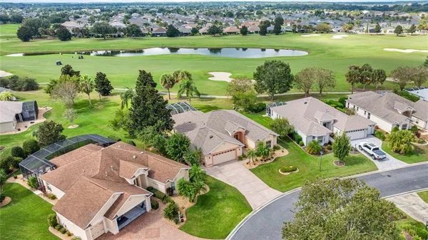 an aerial view of a house with outdoor space and street view