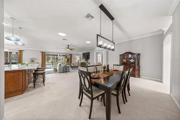 a view of a dining room and livingroom with furniture