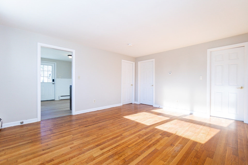 65 Depot Road, Unit A Oxford, MA 01540 - Photo 5 of 17 a view of an empty room and wooden floor