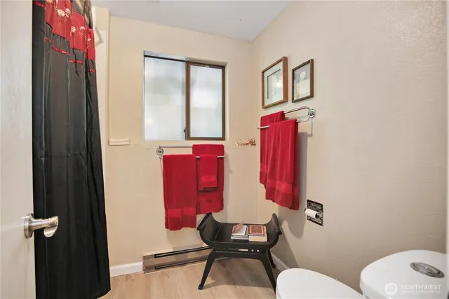 a bedroom with a bed a desk and chair