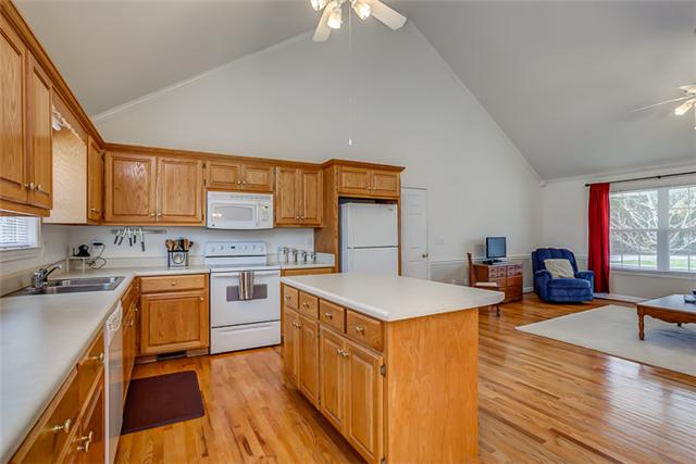 Overlooking the living area, this fully functional kitchen features solid wood cabinets.  You won't find one bit of laminate in these cabinets.