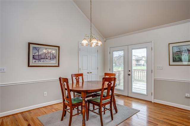 The oversized dining area is open to the kitchen and great room, and features French doors out to the oversized deck.