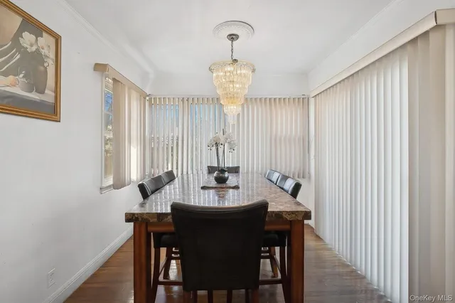 a view of a dining room with furniture and window