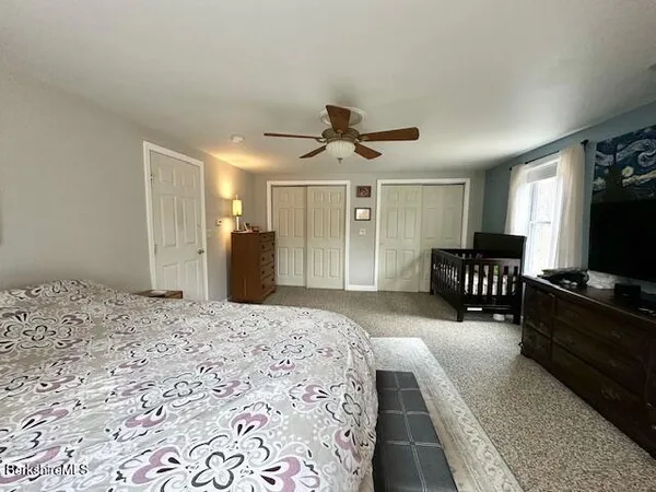 a view of an empty room with a fireplace