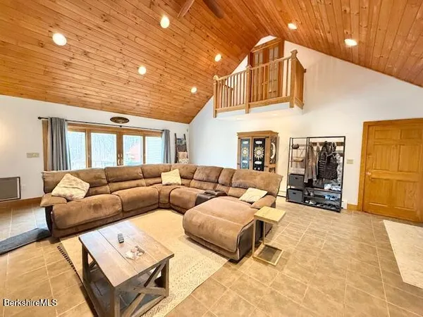 a living room with furniture a couch and a dining table