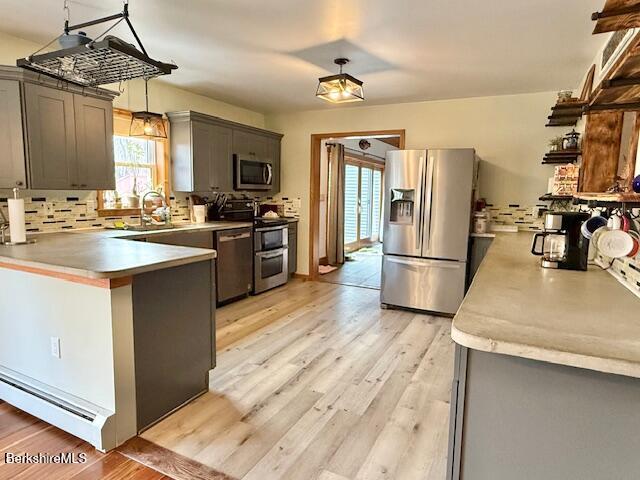279 Goss Hill Road Chester, MA 01050 - Photo 7 of 24 a kitchen with stainless steel appliances granite countertop a refrigerator a sink dishwasher a stove and a dining table with wooden floor