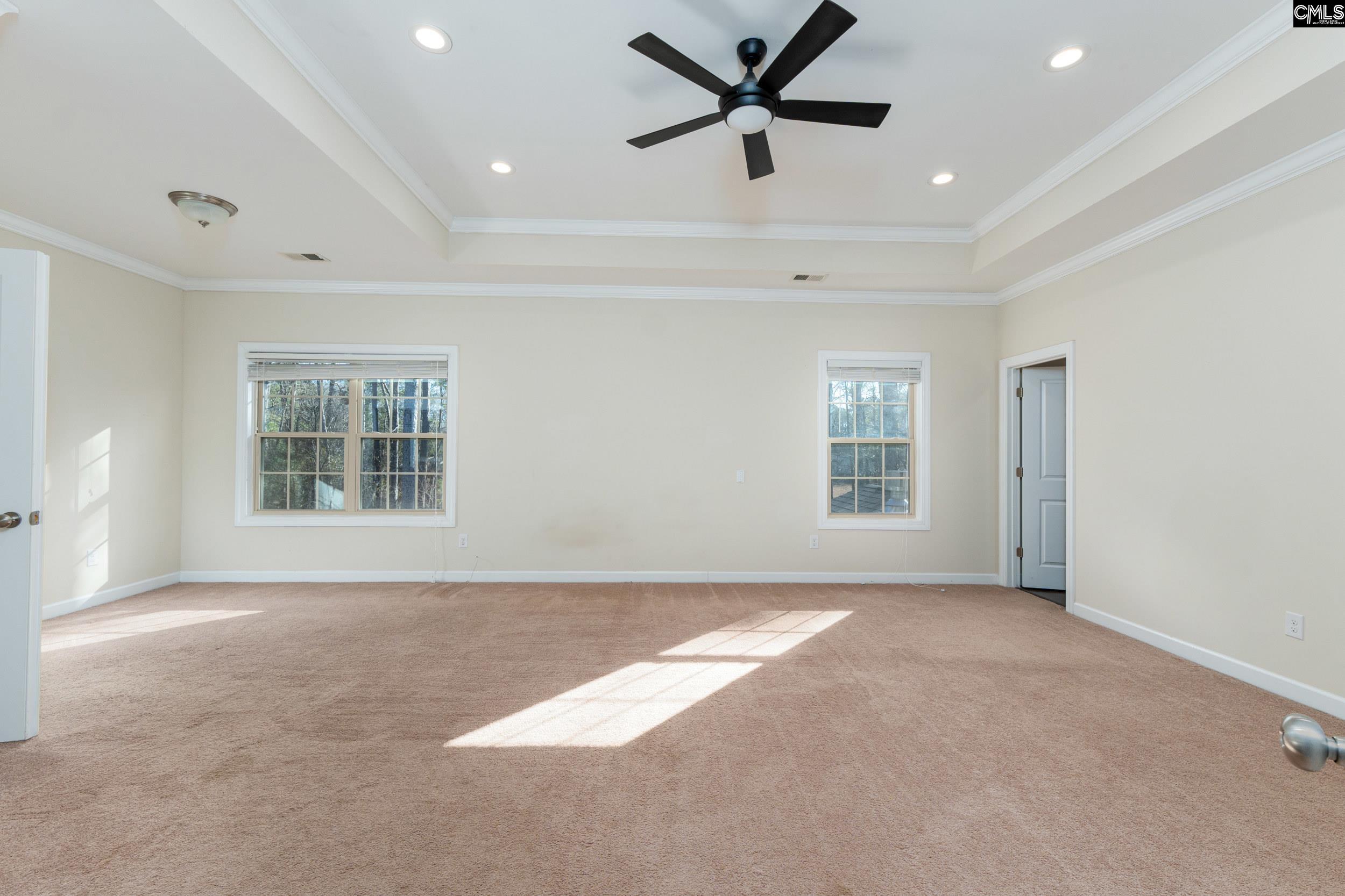 40 Wading Bird Loop Blythewood, SC 29016 - Photo 17 of 26 a view of a livingroom with a ceiling fan and window