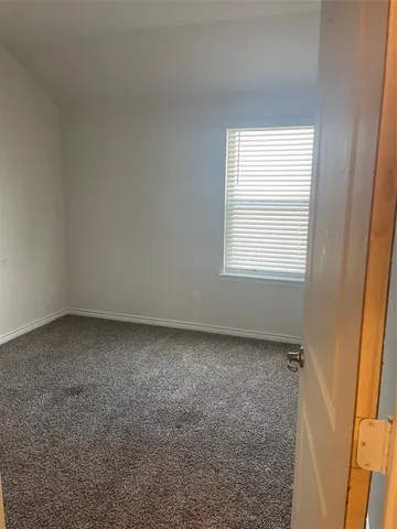 a bathroom with a sink vanity and toilet