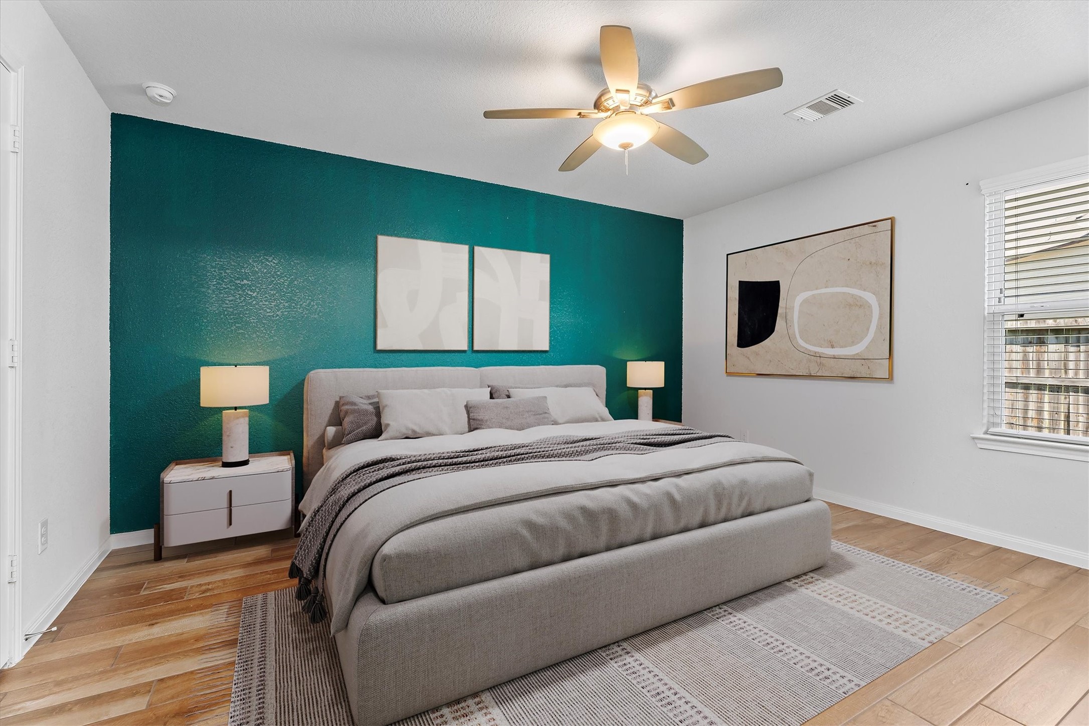 12912 Lake Conroe Bay Road Willis, TX 77318 - Photo 13 of 33 a bedroom with a large bed chandelier and a window