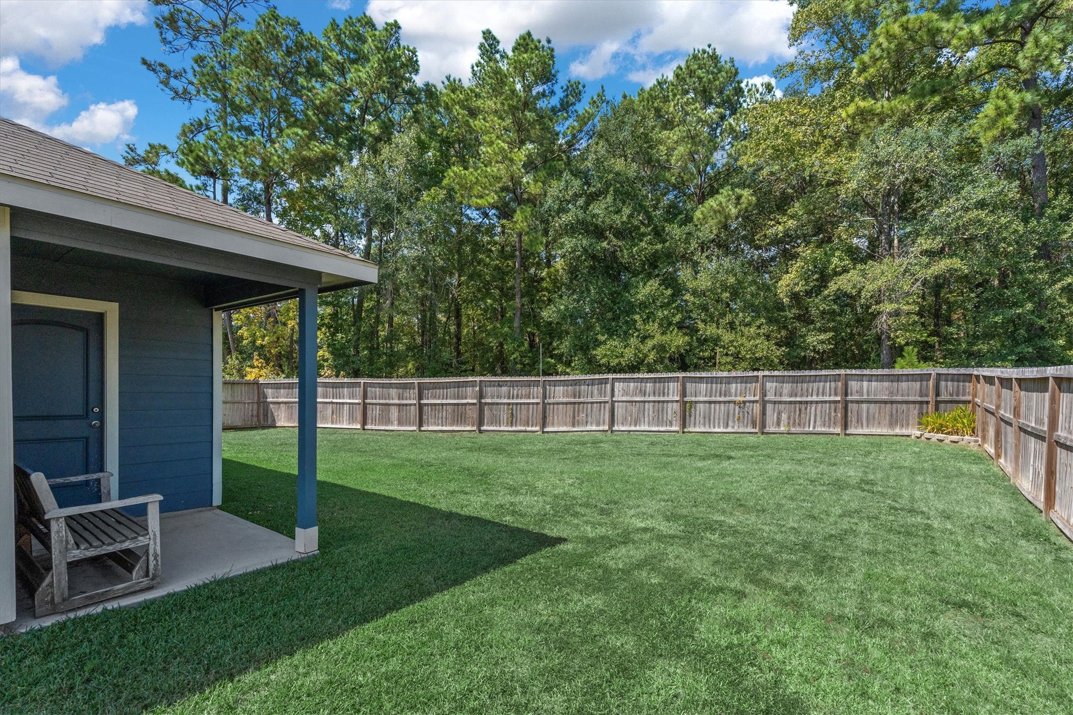 12912 Lake Conroe Bay Road Willis, TX 77318 - Photo 2 of 33 a view of a backyard with table and chairs