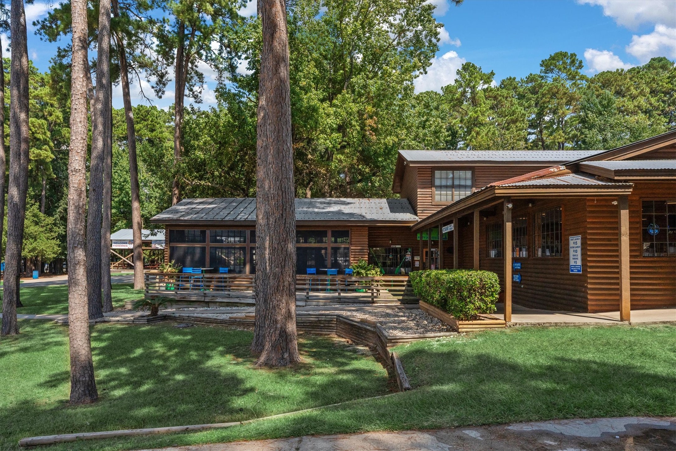 12912 Lake Conroe Bay Road Willis, TX 77318 - Photo 28 of 33 a front view of a house with a yard