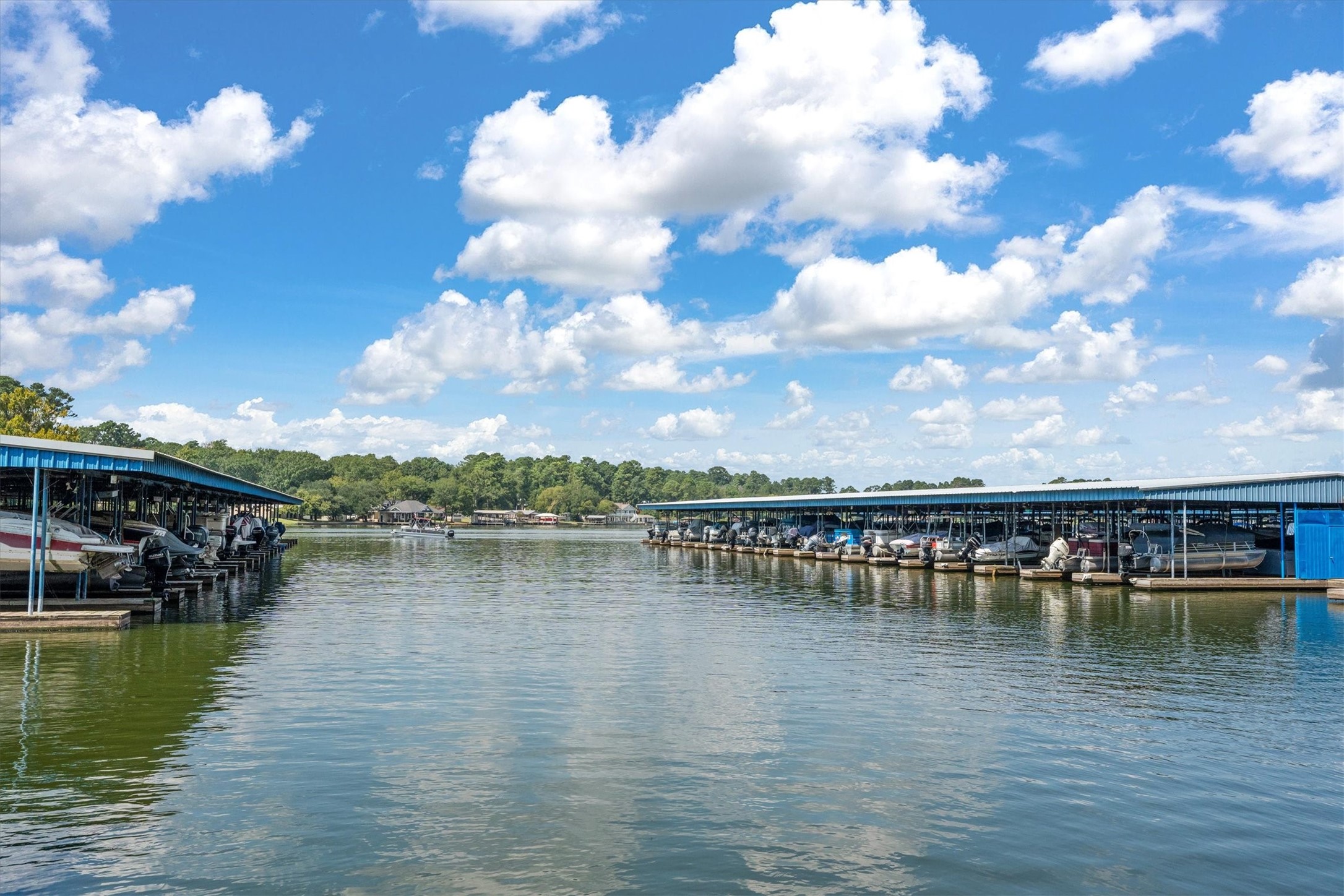 12912 Lake Conroe Bay Road Willis, TX 77318 - Photo 29 of 33 a view of a lake with houses in the back