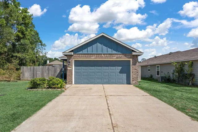 a front view of a house with yard