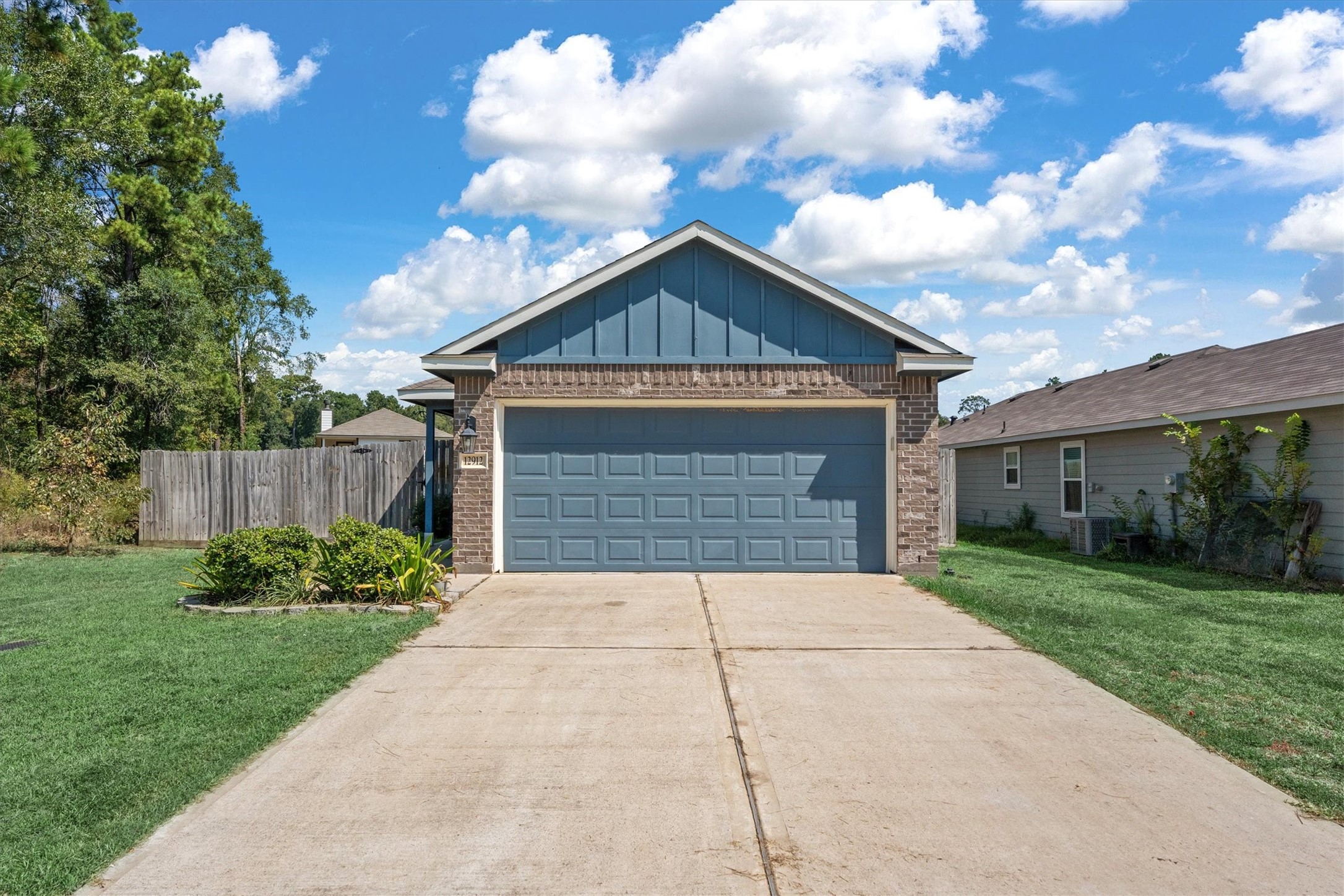 12912 Lake Conroe Bay Road Willis, TX 77318 - Photo 33 of 33 a front view of a house with yard
