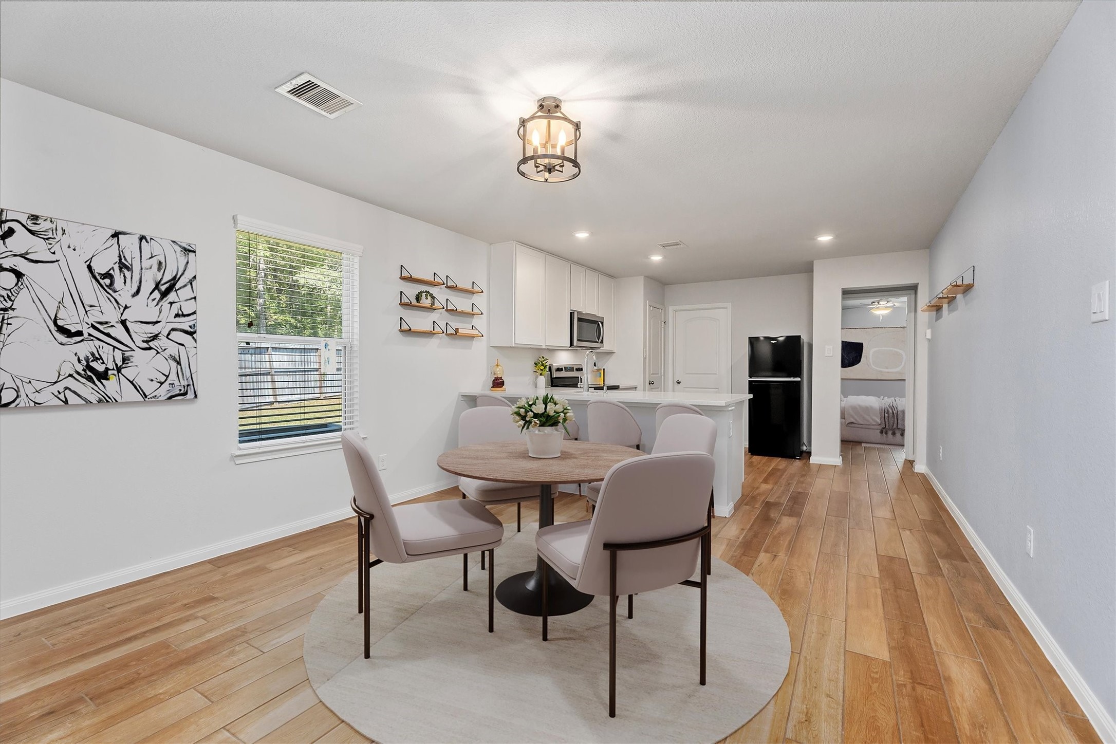 12912 Lake Conroe Bay Road Willis, TX 77318 - Photo 5 of 33 a view of a dining room with furniture window and wooden floor