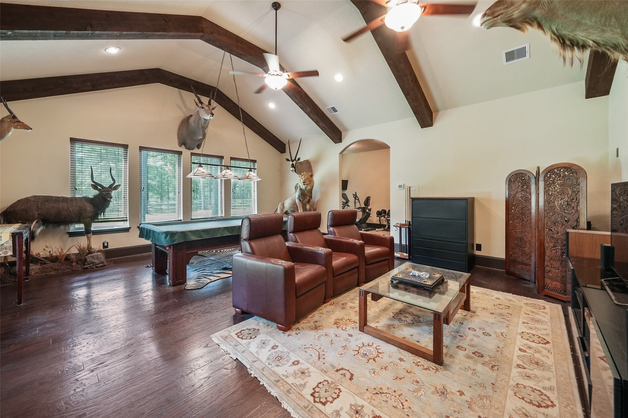26250 A Riley Road Waller, TX 77484 - Photo 20 of 50 Large game room with soaring beamed ceiling and generous windows; adjacent to the flex/gym zone.