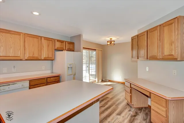 a room with a large bed and cabinets
