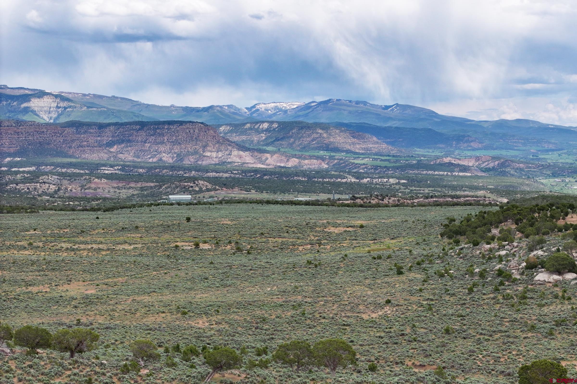1 53 1/2 Road De Beque, CO 81630 - Photo 3 of 6 a view of a lake with mountains in the background