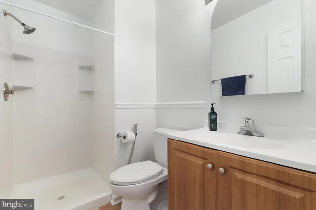 a bathroom with a sink toilet and vanity