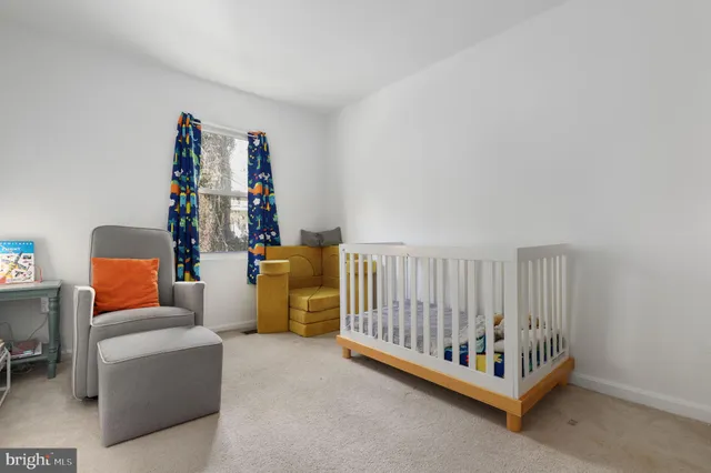 a bed room with furniture and wooden floor
