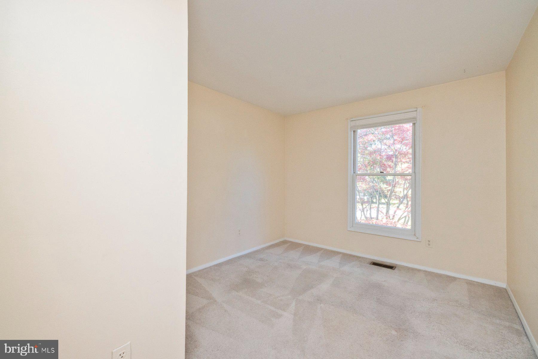 39 Triple Crown Court Gaithersburg, MD 20878 - Photo 20 of 26 a view of an empty room with a window