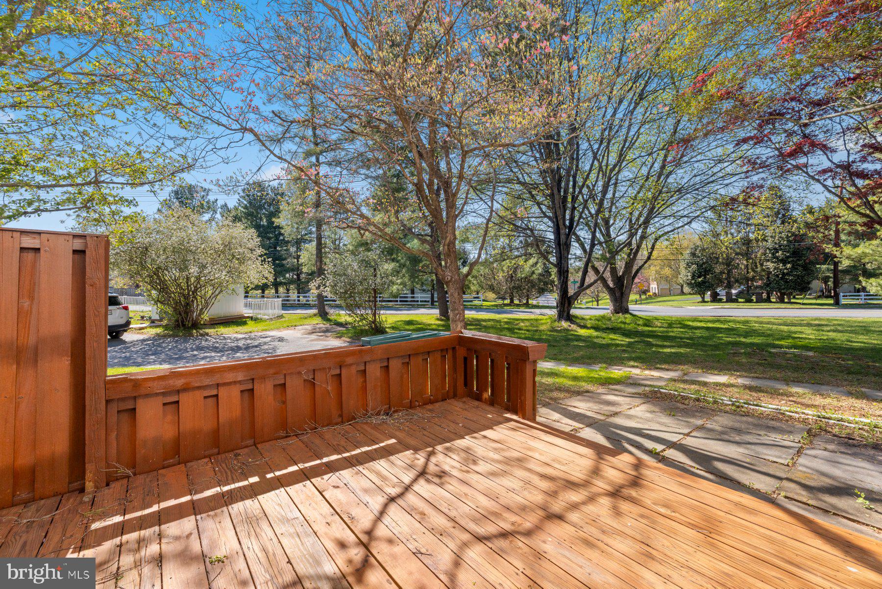 39 Triple Crown Court Gaithersburg, MD 20878 - Photo 3 of 26 a view of a yard with wooden fence