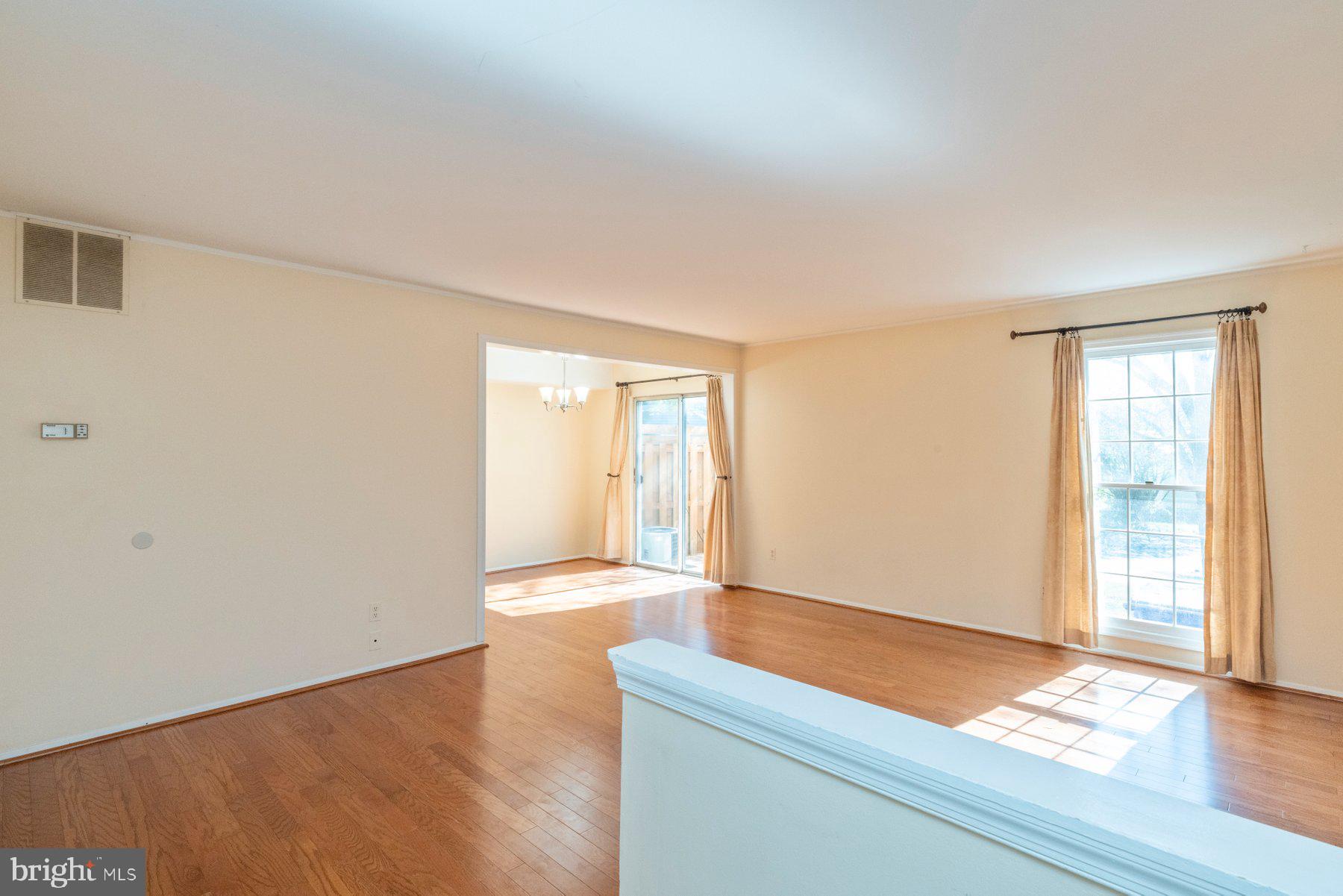 39 Triple Crown Court Gaithersburg, MD 20878 - Photo 4 of 26 a room with a wooden floor and a window