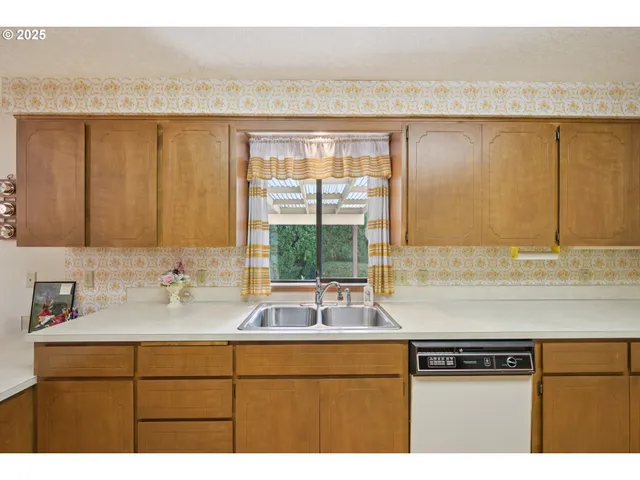 a kitchen with a sink and a window