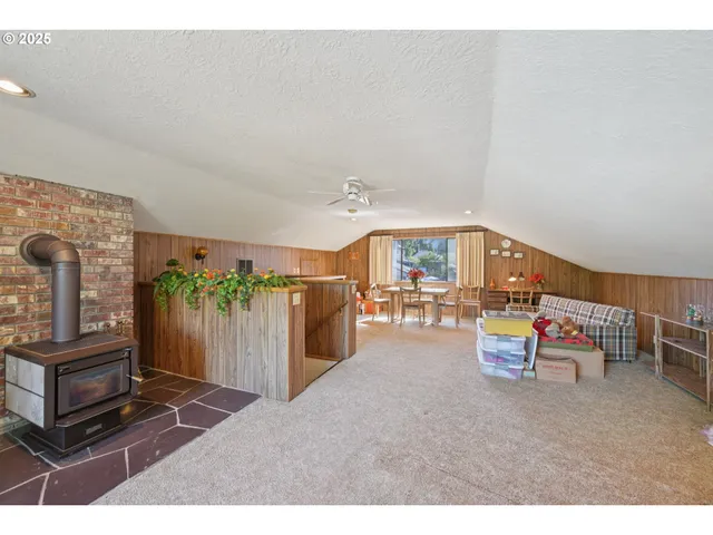 a balcony with furniture and a potted plant