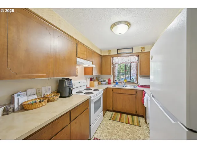 a kitchen with a sink and wooden cabinets