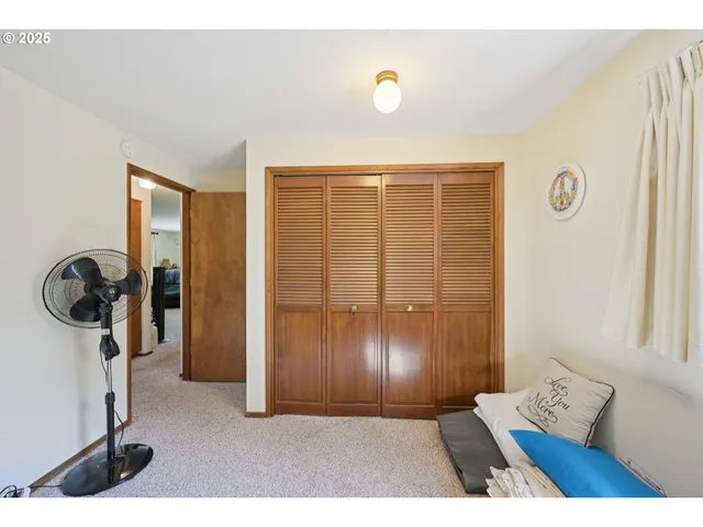 a view of a livingroom with storage and utility