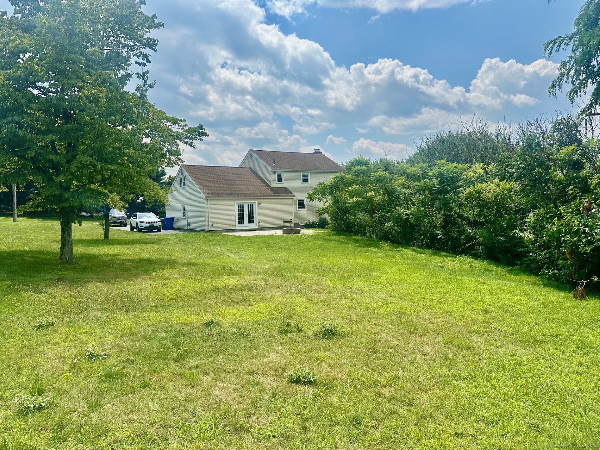 254 Sand Hill Road South Windsor, CT 06074 - Photo 18 of 20 a view of a big yard with plants and large trees