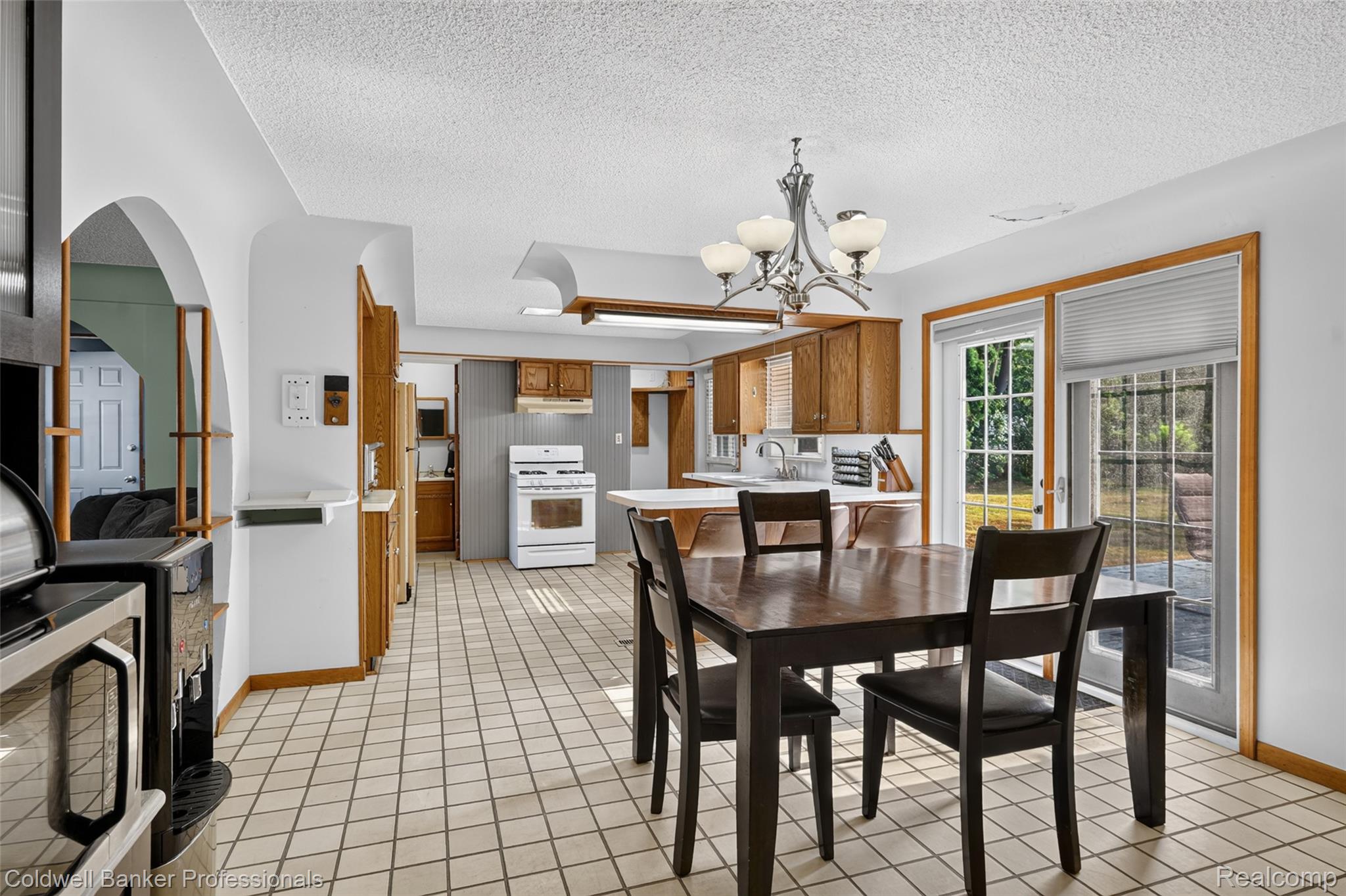 7194 North Center Road Mount Morris, MI 48458 - Photo 13 of 31 Love this open dining/kitchen area with door to deck