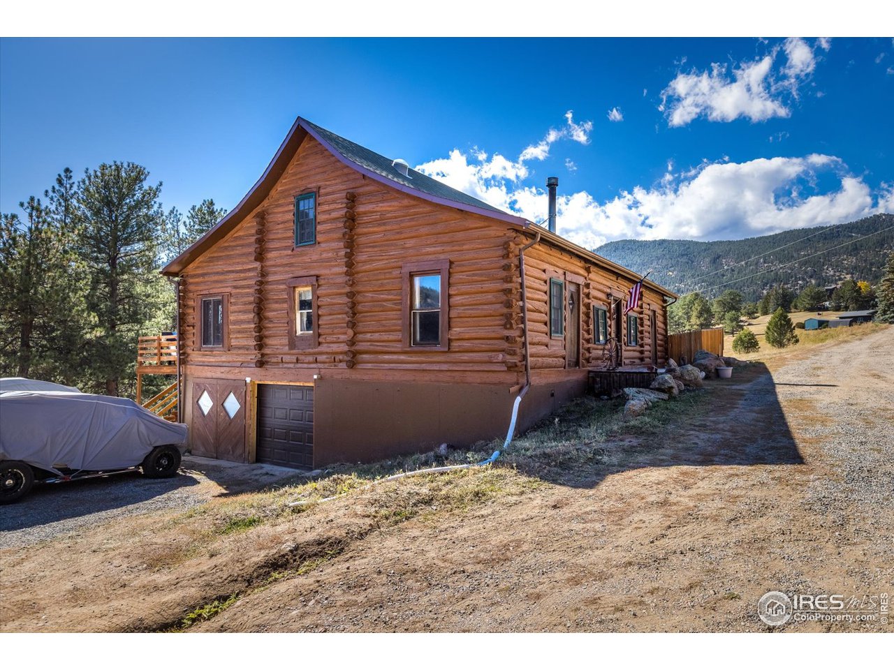 234 Kiowa Road Lyons, CO 80540 - Photo 28 of 39 Side exterior with 2 car garage entry