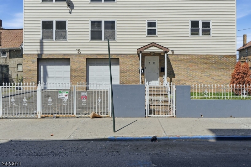 172 Carroll Street Paterson, NJ 07501 - Photo 3 of 48 a front view of a house