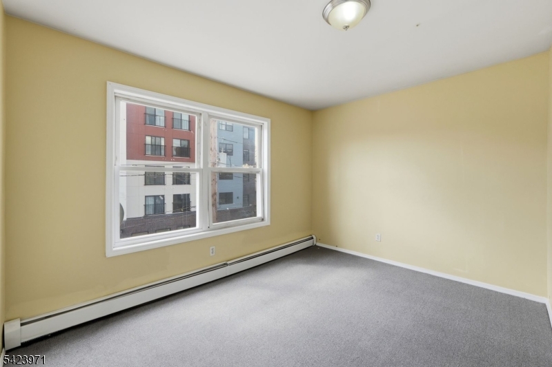 172 Carroll Street Paterson, NJ 07501 - Photo 44 of 48 a view of an empty room with a window
