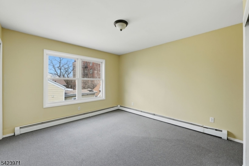 172 Carroll Street Paterson, NJ 07501 - Photo 46 of 48 an empty room with a window