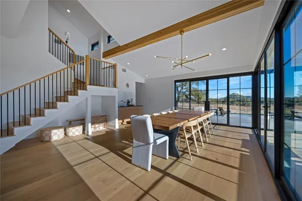 a view of a dining room with furniture window and wooden floor