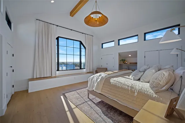 a bedroom with a bed and window