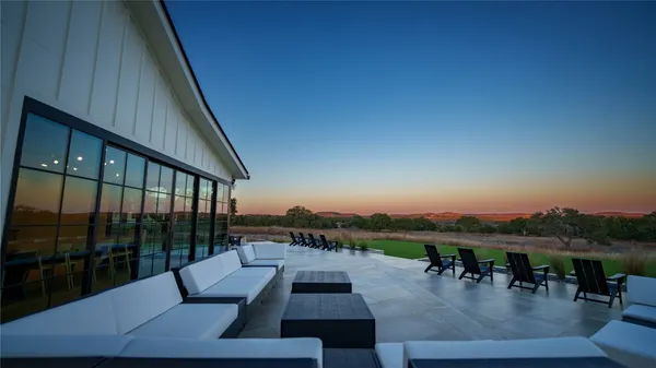 a view of swimming pool with seating area and hardwood floor