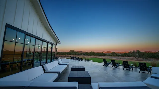 a view of swimming pool with seating area and hardwood floor