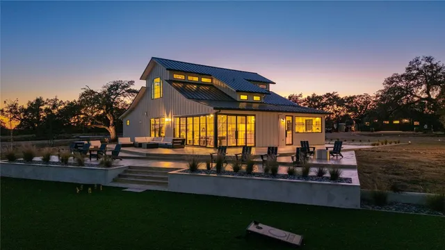 a view of a chairs and table in a yard