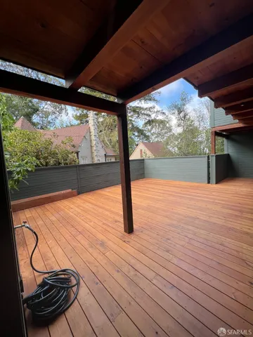 a view of swimming pool with mountain view and wooden floor