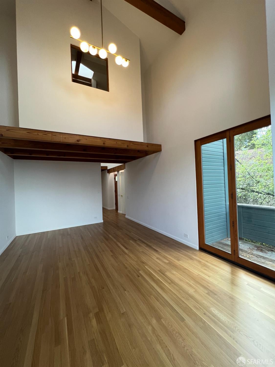 22 Columbia Circle Berkeley, CA 94708 - Photo 4 of 19 a view of empty room with wooden floor and fan