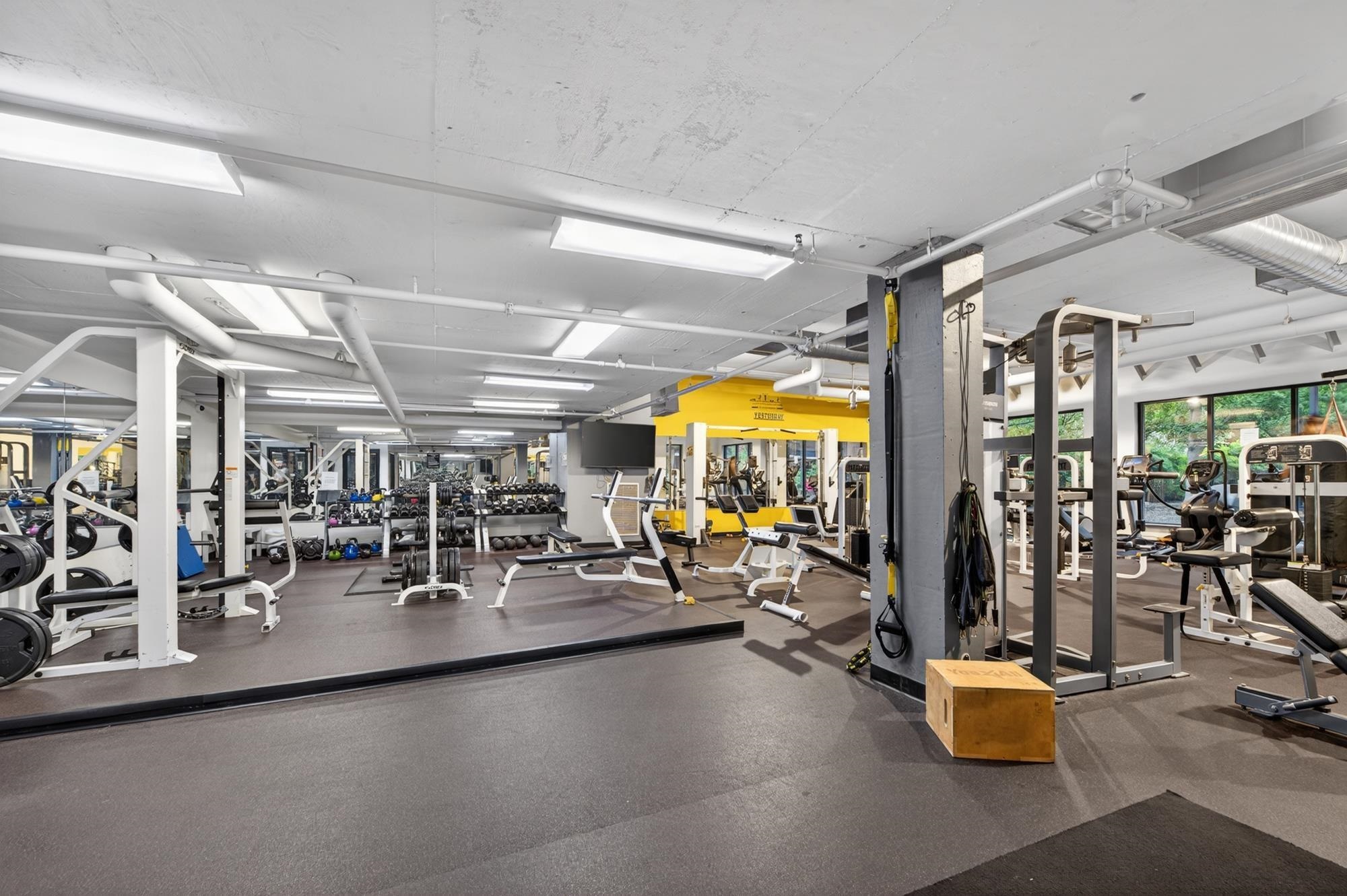 700 Grove Street, Unit 12J Jersey City, NJ 07310 - Photo 14 of 16 a view of a room with gym equipment