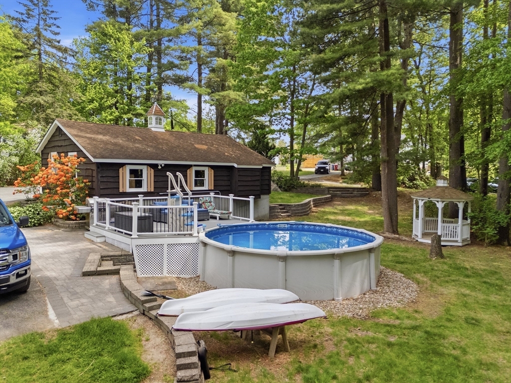 43 Flint Road Tyngsborough, MA 01879 - Photo 27 of 40 a view of a house with pool and chairs
