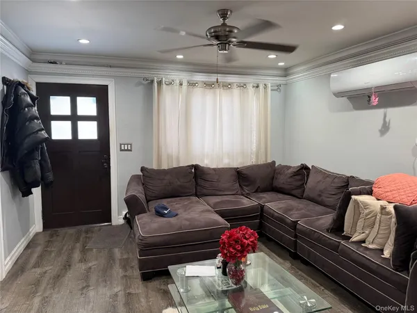 a living room with furniture and a window